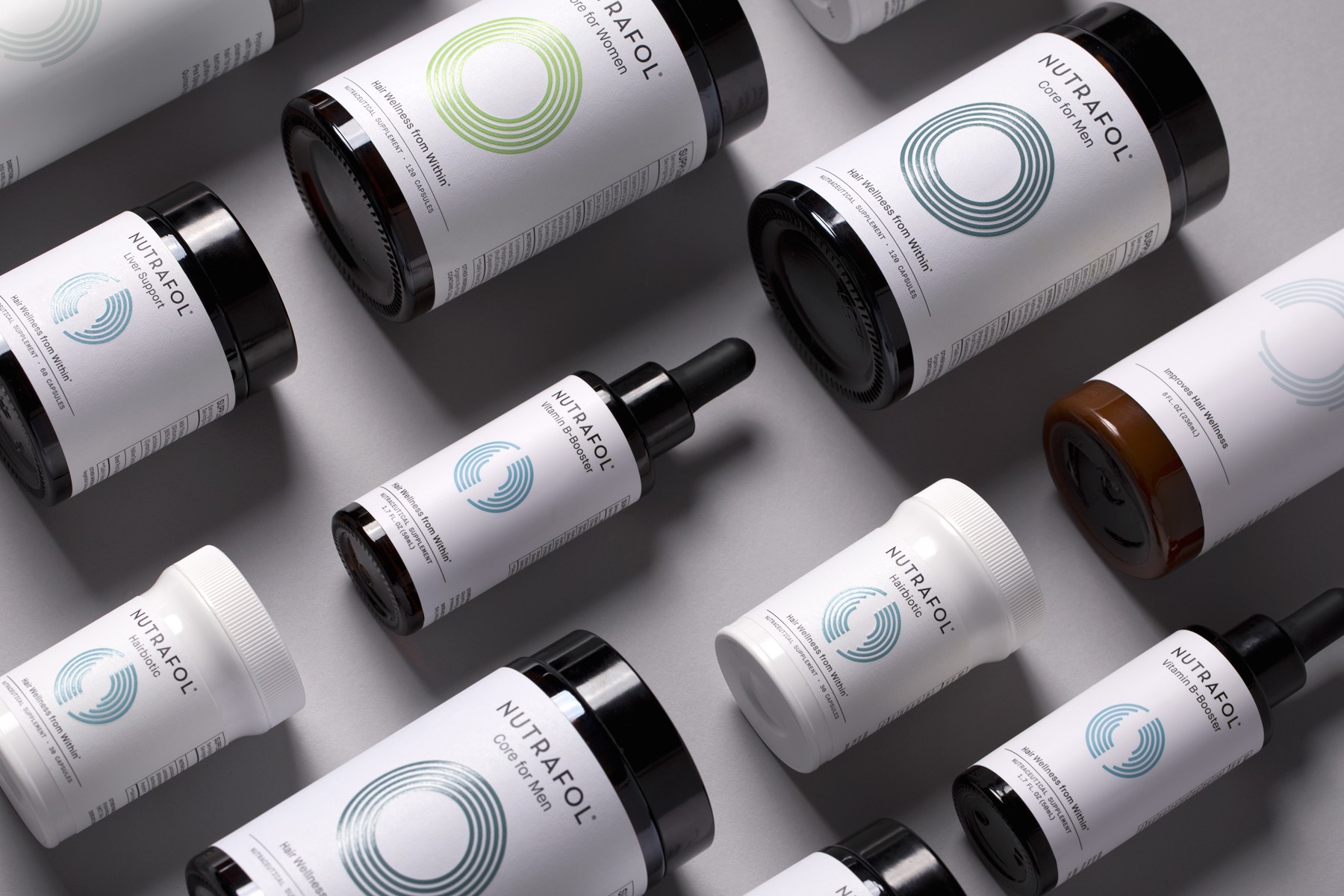 Stylized blue and pink image of a whiskey glass with the wordmark of Vèloce in pink all-caps letters above.